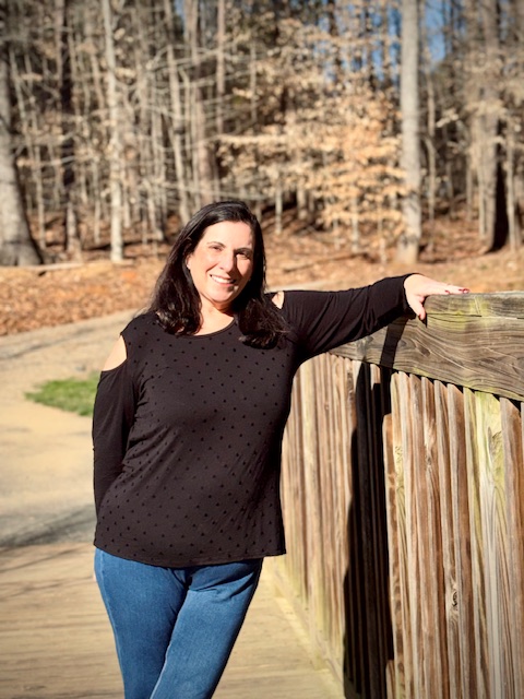 Serina Full Body picture near a fence.